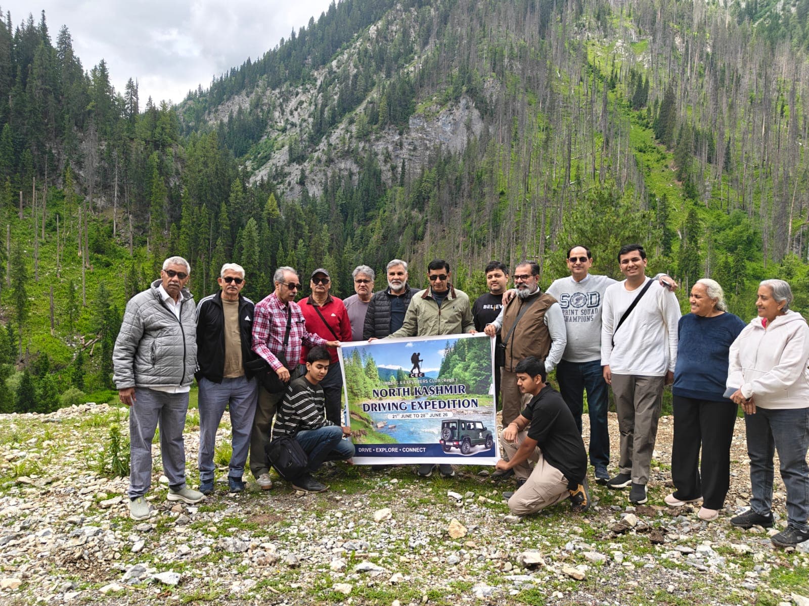 A Himalayan driving expedition team in the forests of North Kashmir
