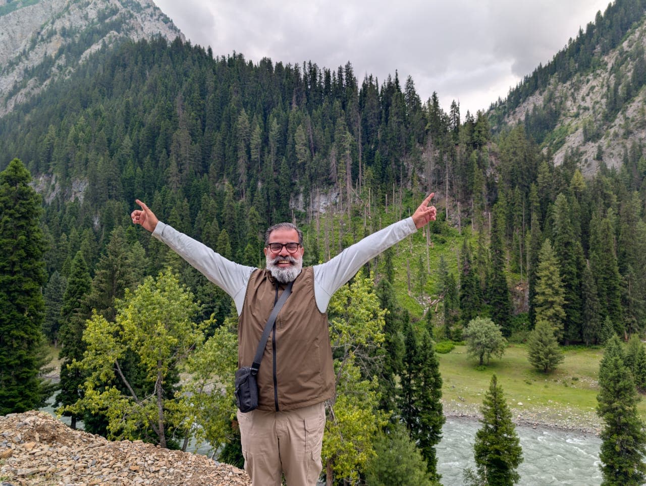 Rajiv Tomar beside a river in a Kashmir valley
