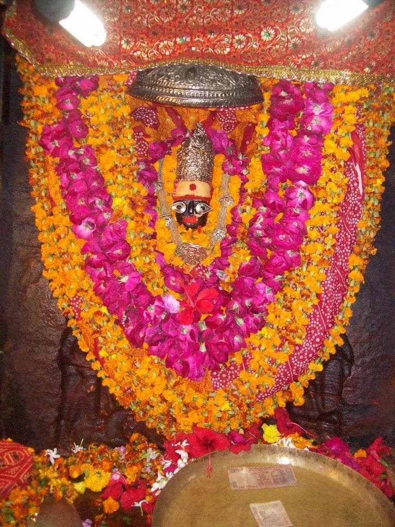A Devi shrine dressed in garlands
