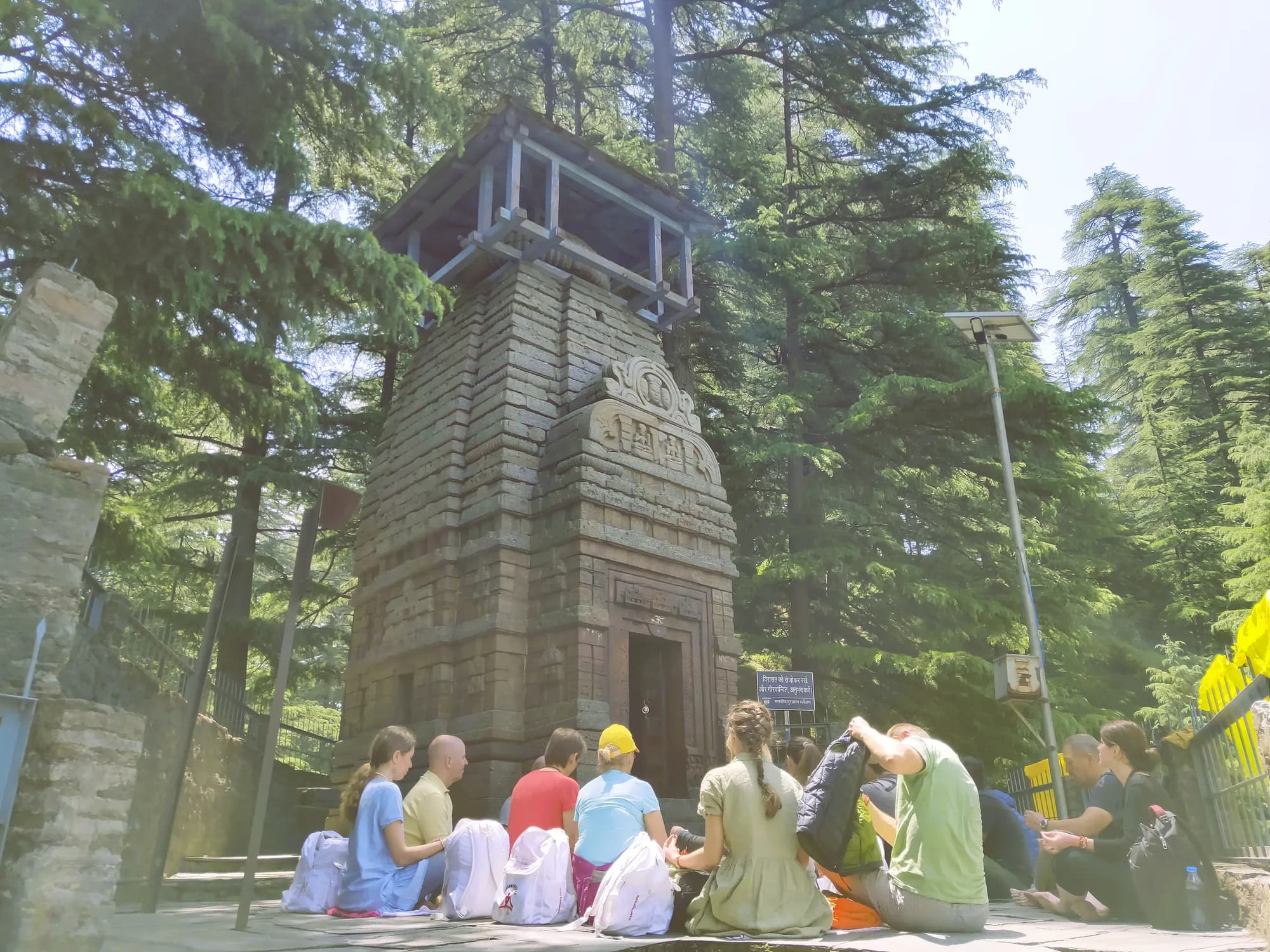 Pilgrims resting at a forest temple