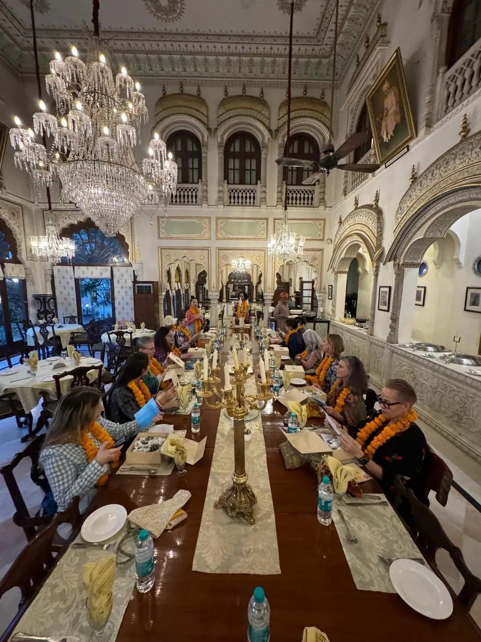 Dinner beneath crystal chandeliers in a heritage hotel dining hall